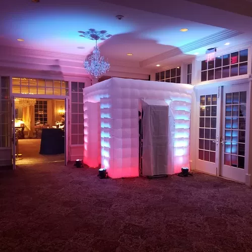 Inflatable LED photo booth enclosure at an event